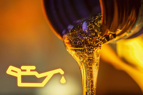 close up of car oil being poured