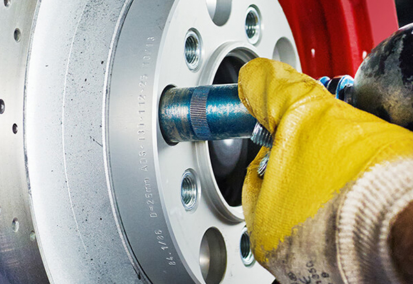 mechanic working on brakes