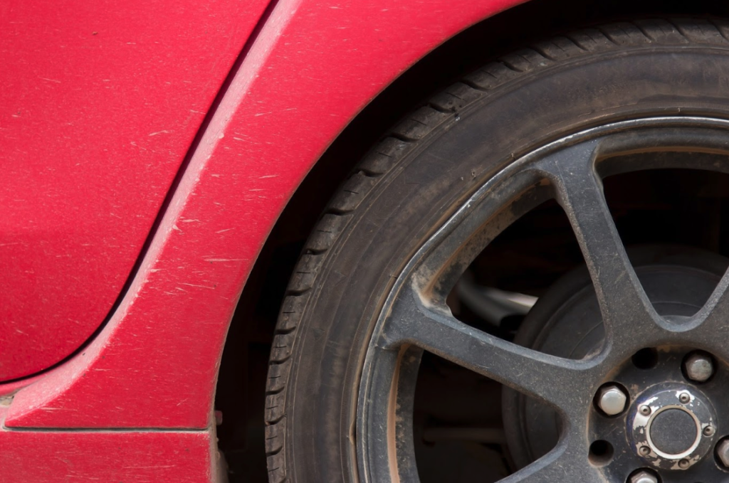 close up of tire on red car